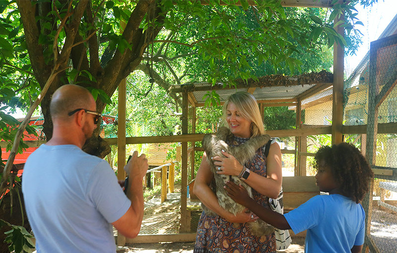 holding a sloth roatan honduras